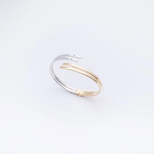 Stylish curved gold and silver bracelet